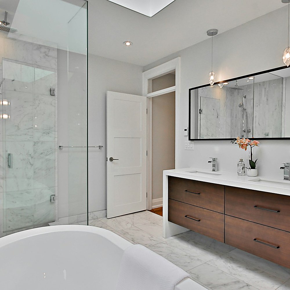 Warm Modern style bathroom designed by Next Level Design