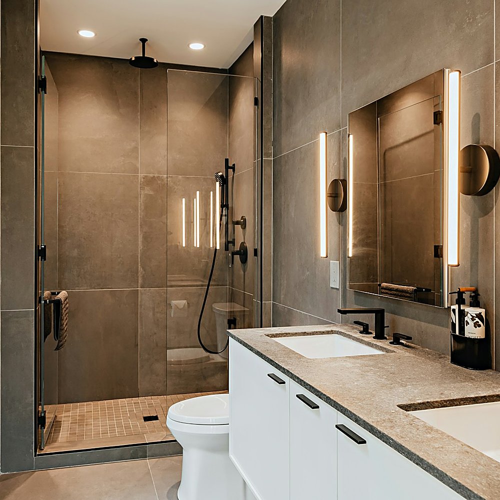 Warm Modern style bathroom designed by Next Level Design